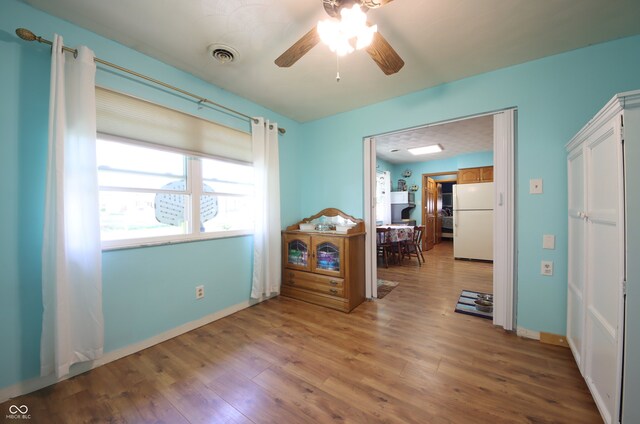 5041 Norcroft Dr, Indianapolis, IN 46221 - interior space with a ceiling fan, baseboards, visible vents, and wood finished floors