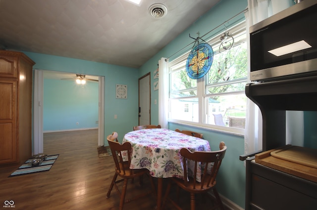 5041 Norcroft Dr, Indianapolis, IN 46221 - dining space featuring ceiling fan, wood finished floors, and visible vents
