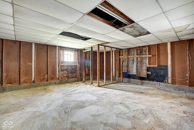 basement featuring a drop ceiling