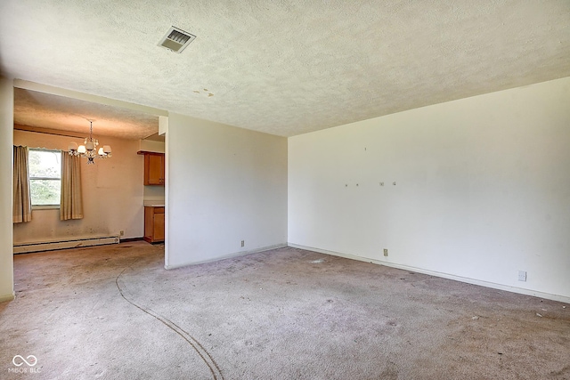 spare room featuring a textured ceiling, visible vents, a baseboard heating unit, a chandelier, and light carpet