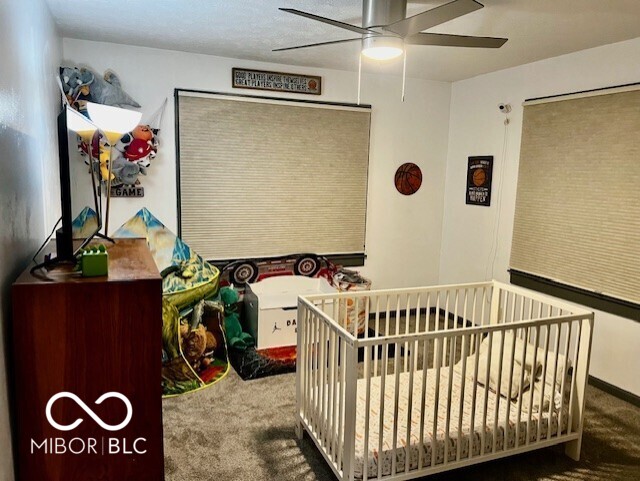 bedroom featuring carpet floors and ceiling fan