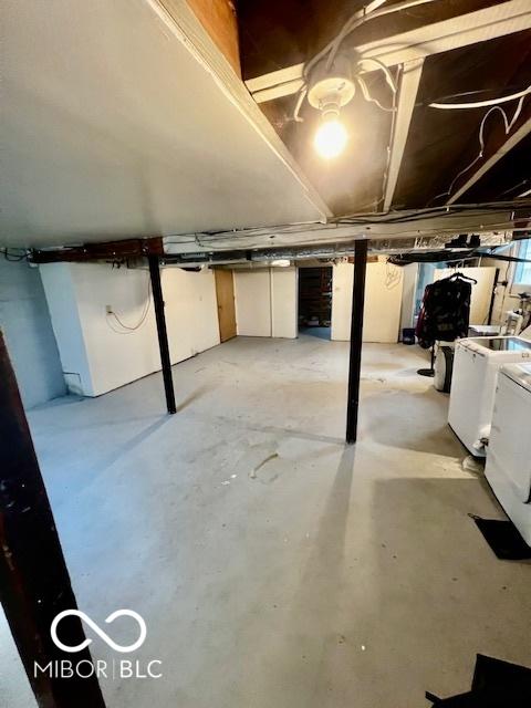 unfinished basement featuring separate washer and dryer