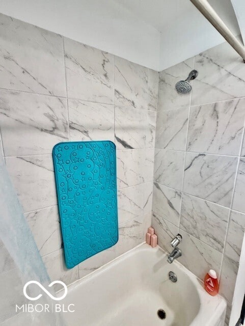 full bathroom featuring tub / shower combination