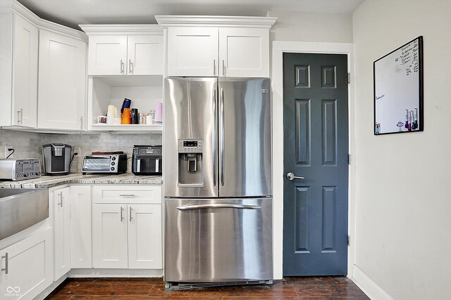 1641 Iowa St, Indianapolis, IN 46203 - kitchen with stainless steel fridge with ice dispenser, dark wood-type flooring, and white cabinets