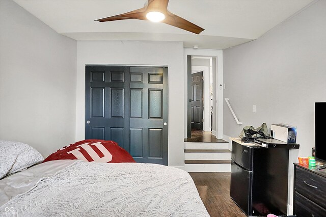 1641 Iowa St, Indianapolis, IN 46203 - bedroom featuring dark wood-style floors, freestanding refrigerator, a closet, and ceiling fan