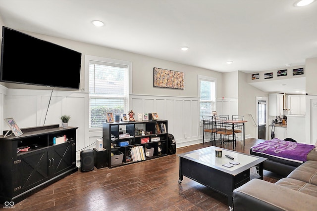 1641 Iowa St, Indianapolis, IN 46203 - living area with a decorative wall, wainscoting, dark wood finished floors, and recessed lighting