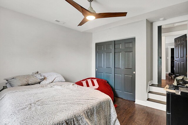 1641 Iowa St, Indianapolis, IN 46203 - bedroom with dark wood-style floors, ceiling fan, baseboards, and a closet