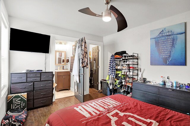 1641 Iowa St, Indianapolis, IN 46203 - bedroom with dark wood-type flooring, connected bathroom, and ceiling fan
