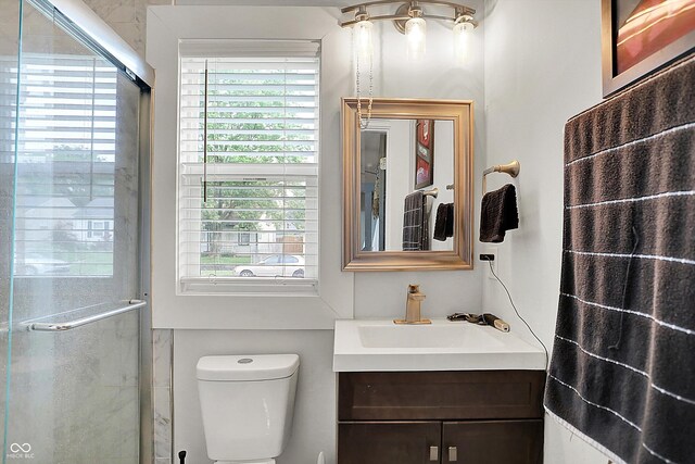 1641 Iowa St, Indianapolis, IN 46203 - full bath with vanity, healthy amount of natural light, a stall shower, and toilet