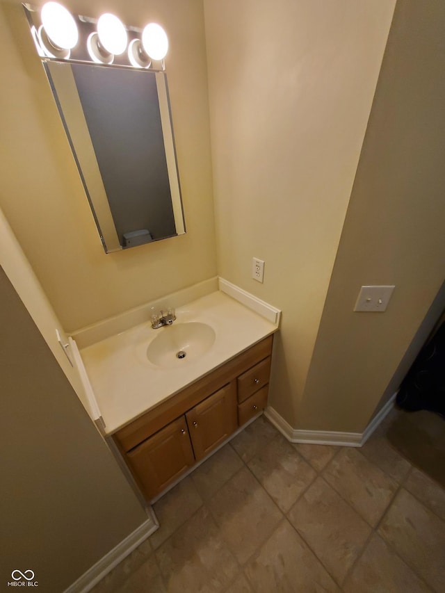 1050 Jefferson Ave, Indianapolis, IN 46201 - bathroom with tile patterned floors, baseboards, and vanity