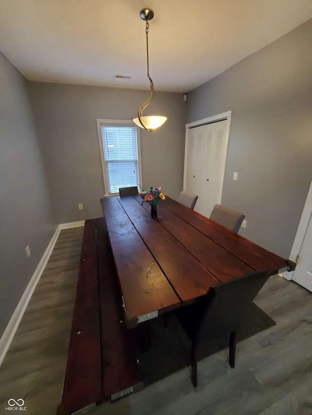 1050 Jefferson Ave, Indianapolis, IN 46201 - dining space with baseboards and dark wood finished floors