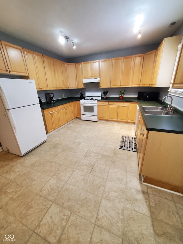 1050 Jefferson Ave, Indianapolis, IN 46201 - kitchen featuring light brown cabinets, dark countertops, white appliances, under cabinet range hood, and a sink