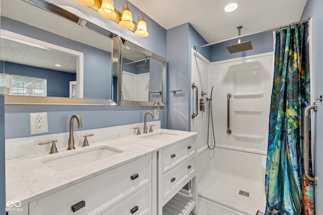bathroom with a sink, double vanity, a shower stall, and marble finish floor