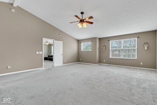 carpeted empty room featuring visible vents, baseboards, and a ceiling fan