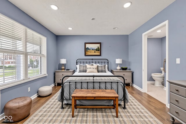 3652 Newberry Rd, Plainfield, IN 46168 - bedroom featuring wood finished floors, recessed lighting, baseboards, and ensuite bathroom