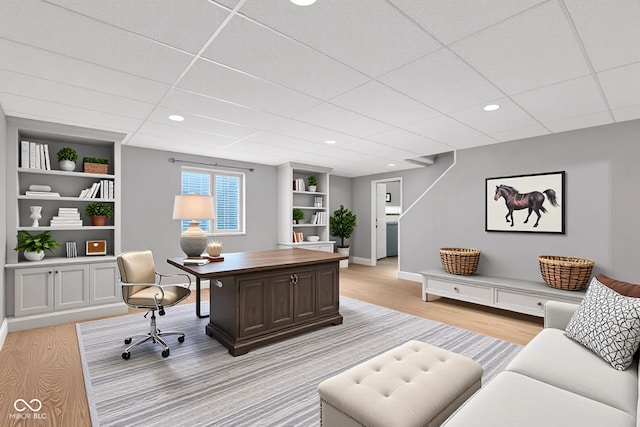3652 Newberry Rd, Plainfield, IN 46168 - office featuring light wood-type flooring, built in features, a drop ceiling, baseboards, and recessed lighting