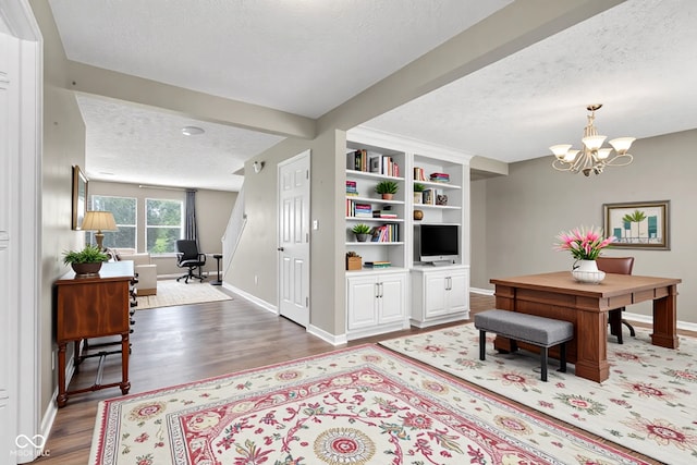 3652 Newberry Rd, Plainfield, IN 46168 - living area with a textured ceiling, baseboards, wood finished floors, an office area, and a chandelier
