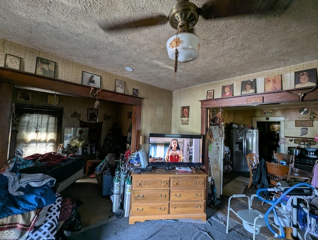 misc room with carpet flooring and a textured ceiling