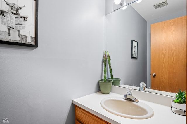 bathroom featuring visible vents and vanity
