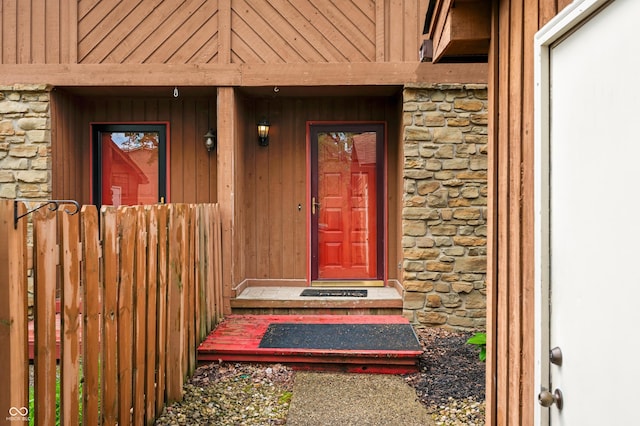 view of exterior entry featuring stone siding