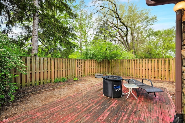 view of patio with a fenced backyard and a wooden deck