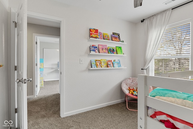 bedroom featuring baseboards and carpet flooring