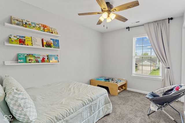 bedroom featuring baseboards, ceiling fan, carpet flooring, and visible vents