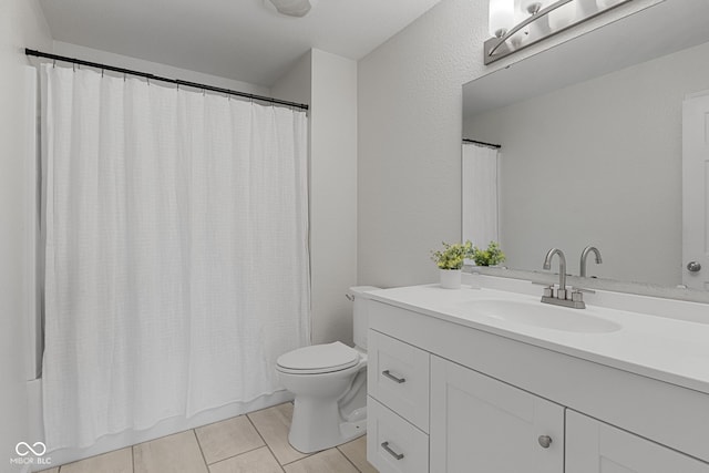 full bath featuring vanity and toilet