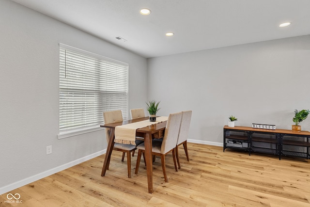 dining area with baseboards, light wood finished floors, recessed lighting, and visible vents