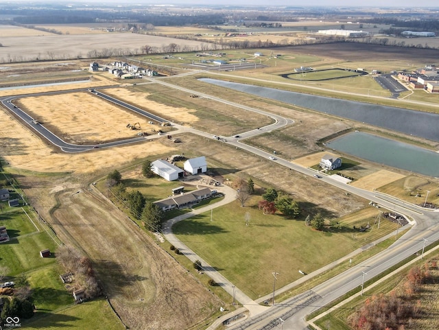 drone / aerial view featuring a water view and a rural view