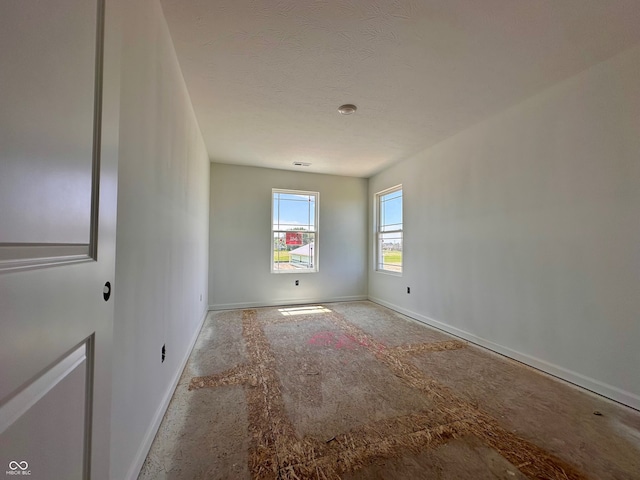 1216 Mcbride St, Greenfield, IN 46140 - unfurnished room featuring baseboards and a textured ceiling