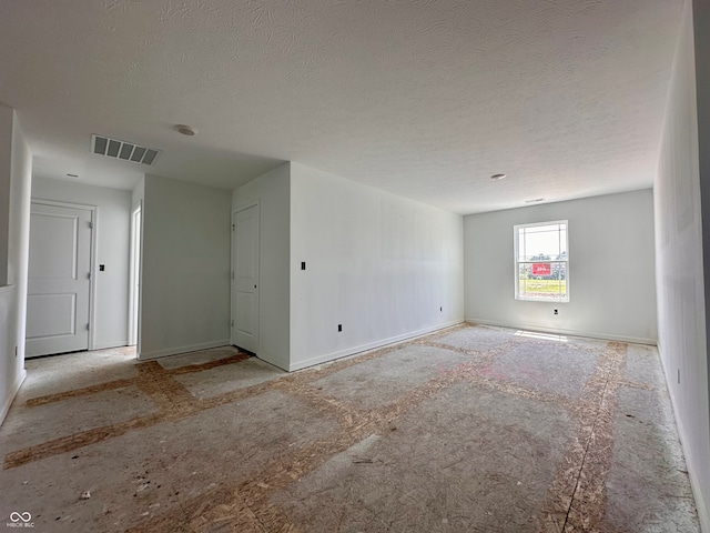 1216 Mcbride St, Greenfield, IN 46140 - spare room featuring a textured ceiling and baseboards