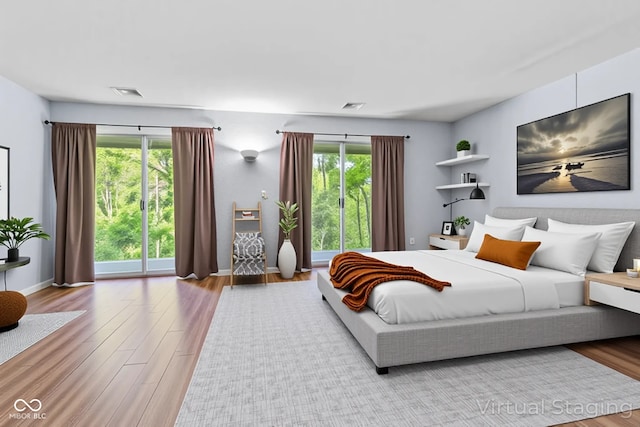 1686 Borders Rd, Nashville, IN 47448 - bedroom featuring wood finished floors, multiple windows, and baseboards