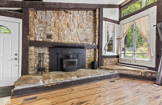 1686 Borders Rd, Nashville, IN 47448 - entrance foyer with a wood stove and wood finished floors