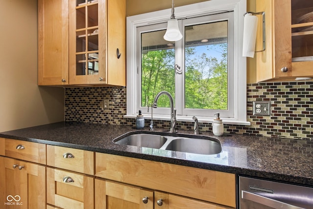 1686 Borders Rd, Nashville, IN 47448 - kitchen featuring a sink, backsplash, glass insert cabinets, pendant lighting, and dark stone countertops