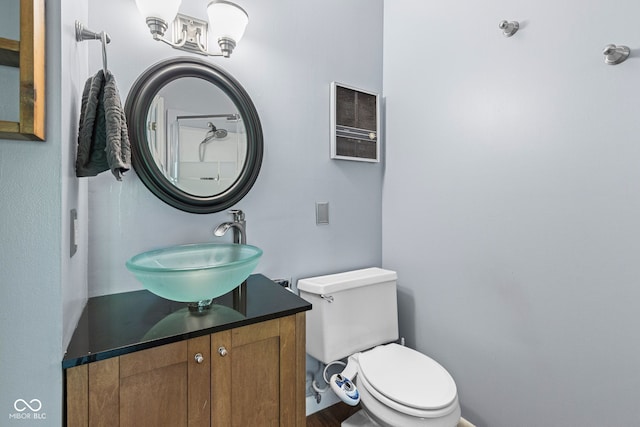 1686 Borders Rd, Nashville, IN 47448 - bathroom featuring a sink, a chandelier, toilet, and wood finished floors