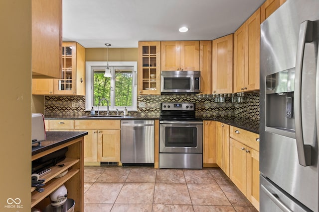 1686 Borders Rd, Nashville, IN 47448 - kitchen featuring stainless steel appliances, a sink, tasteful backsplash, decorative light fixtures, and glass insert cabinets