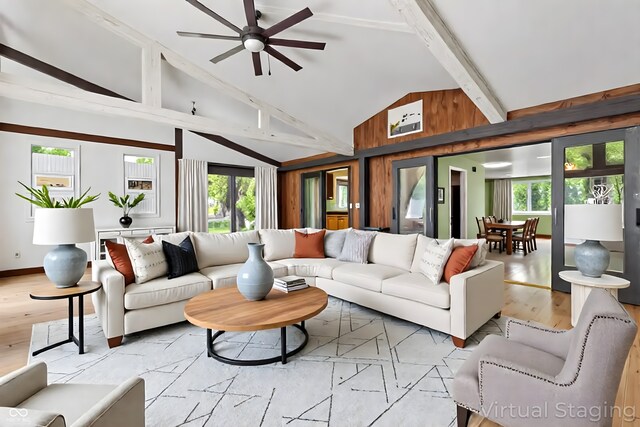 1686 Borders Rd, Nashville, IN 47448 - living room featuring high vaulted ceiling, a ceiling fan, light wood-type flooring, beamed ceiling, and baseboards