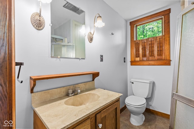 1686 Borders Rd, Nashville, IN 47448 - bathroom featuring toilet, baseboards, vanity, and tile patterned flooring