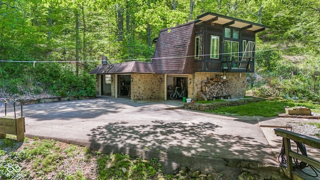 1686 Borders Rd, Nashville, IN 47448 - view of front of property with stone siding and a view of trees