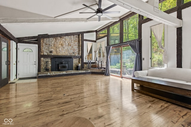 1686 Borders Rd, Nashville, IN 47448 - living area with beam ceiling, a ceiling fan, wood-type flooring, a fireplace, and high vaulted ceiling