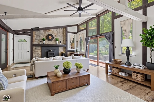 1686 Borders Rd, Nashville, IN 47448 - living room featuring wood finished floors, ceiling fan, beamed ceiling, and high vaulted ceiling