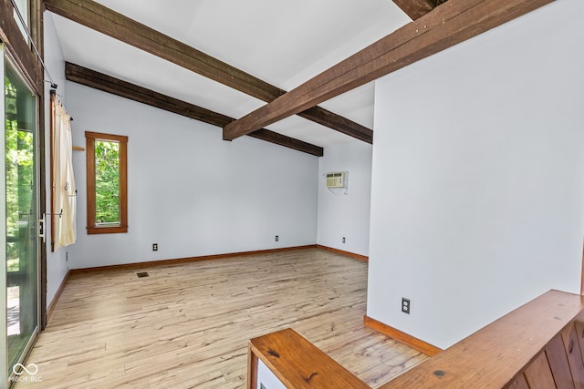 1686 Borders Rd, Nashville, IN 47448 - unfurnished living room with beamed ceiling, light wood-style floors, and baseboards