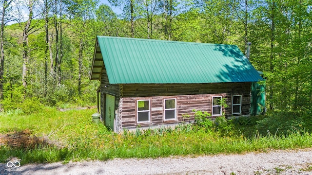 1686 Borders Rd, Nashville, IN 47448 - view of side of home featuring metal roof and a garage