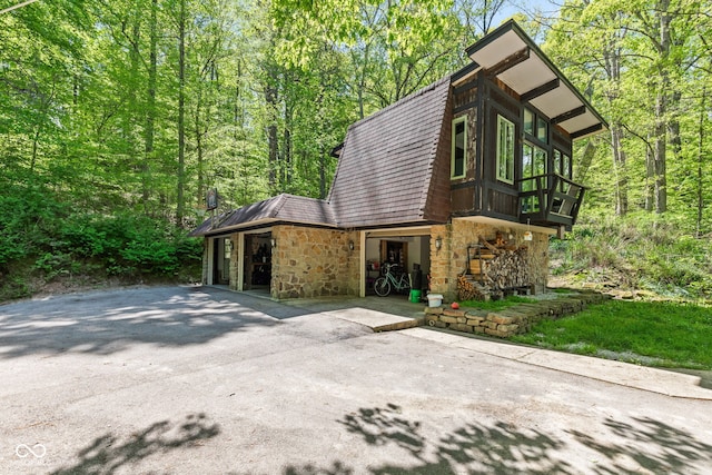 1686 Borders Rd, Nashville, IN 47448 - view of front of property with stone siding and a forest view