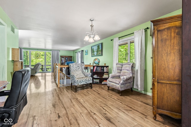 1686 Borders Rd, Nashville, IN 47448 - living room with light wood-style floors, plenty of natural light, and a chandelier