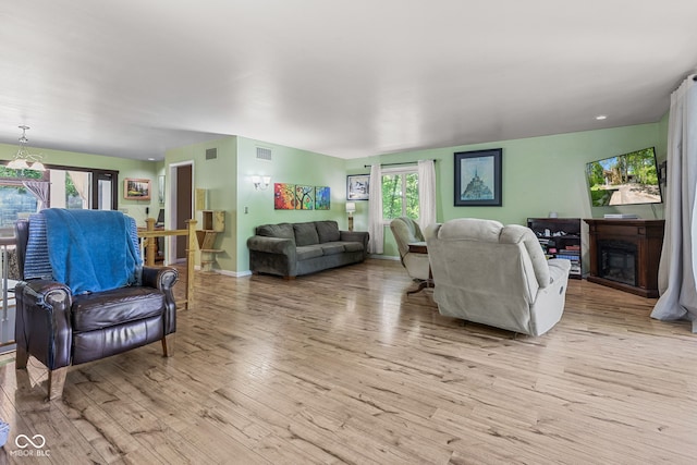 1686 Borders Rd, Nashville, IN 47448 - living area with light wood-type flooring, a fireplace, and baseboards