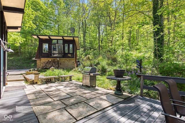 1686 Borders Rd, Nashville, IN 47448 - wooden deck with grilling area, a view of trees, and a patio area