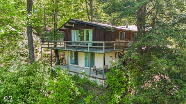 1686 Borders Rd, Nashville, IN 47448 - rear view of property featuring a deck and a patio area