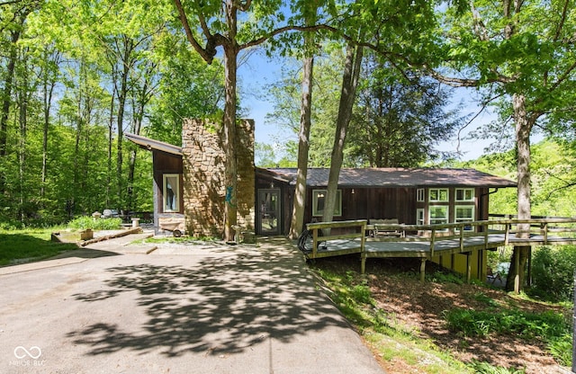 1686 Borders Rd, Nashville, IN 47448 - view of front of house featuring a wooden deck and a chimney